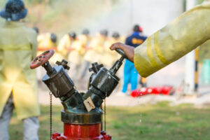 blurred firemen using water from hose fire fighting 38161 1285 1