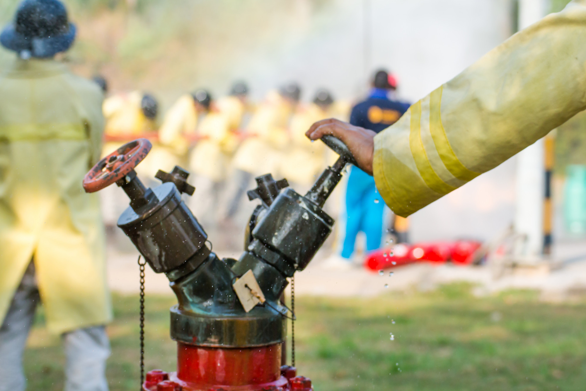 blurred firemen using water from hose fire fighting 38161 1285 1