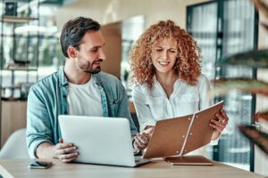 disappointed businesswoman looking notebook with coworker cafe businessman client meeting cafe 549545 2486