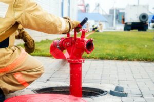 firefighter sits fire hydrant back view firemen training 230115 4451 1
