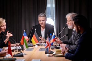 group poltical leaders sitting with microphones press conference having talk hold meeting without ties discuss ideas issues agenda modern boardroom 183219 5938