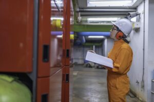 maintenance technician heating plantpetrochemical workers supervise operation gas oil pipelines factoryengineers put hearing protector room with many pipes 44277 27085 1