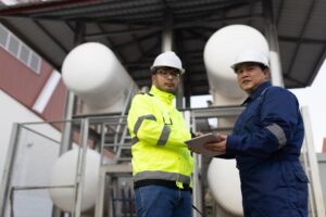portrait two happy workers metal stock standing together posing looking camera 69769 1373