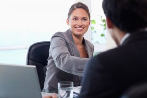 smiling businesswoman welcomes customer 13339 208083
