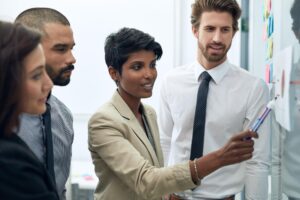 woman manager talk business group whiteboard talking about training plan working communication management leader with writer team looking paperwork sticky notes 590464 173926