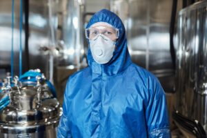 worker wearing protective gear looking camera chemical plant 236854 47542