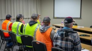 workers watching safety training video together followed by discussion about its key takeaways 216520 221722